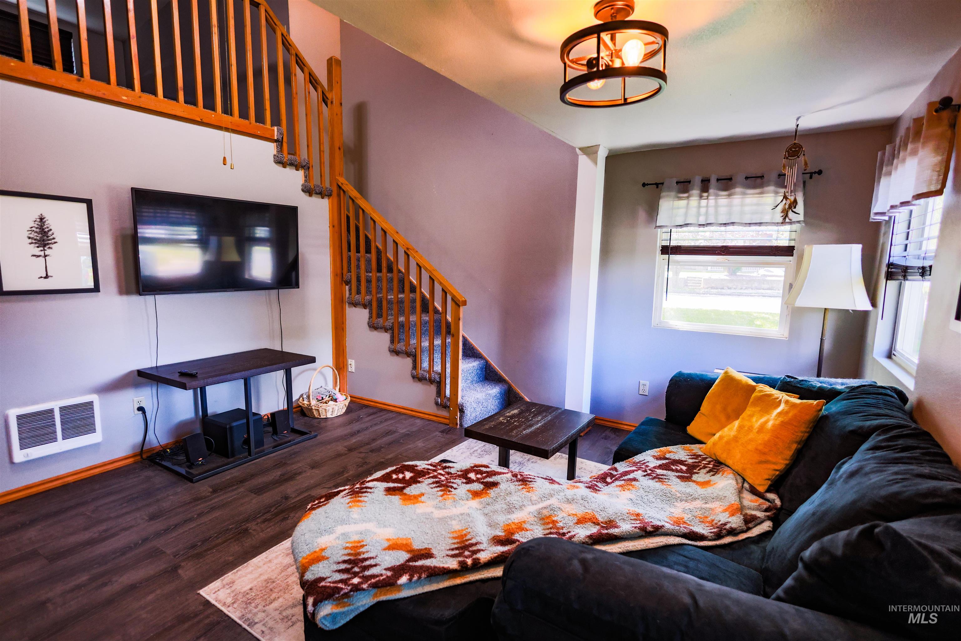 515 8th Street Kamiah, ID 83536 - Photo 14 of 31 Wood-finish flooring throughout, featuring a natural wood staircase and railing