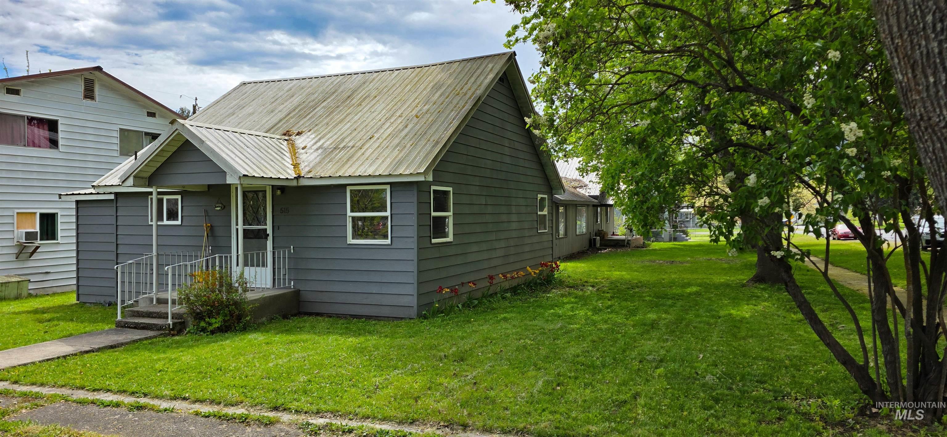 515 8th Street Kamiah, ID 83536 - Photo 31 of 31 Single-story residence featuring gray siding and a corrugated metal roof