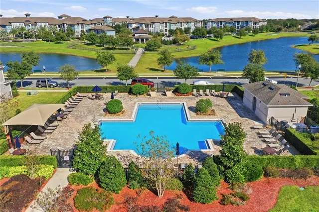 an aerial view of a house with garden space and mountain view