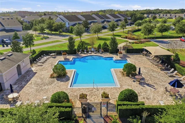 an aerial view of residential houses with outdoor space