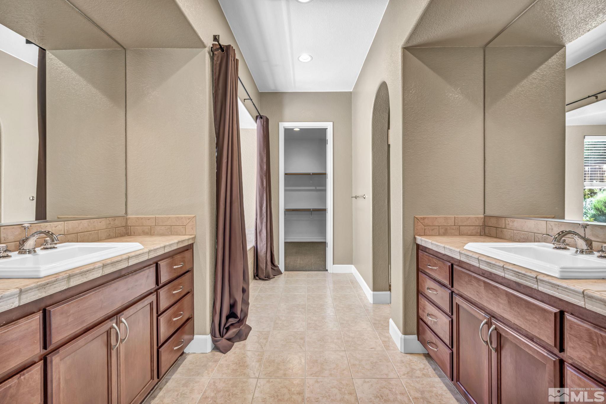 8210 Willow Ranch Trail Reno, NV 89523 - Photo 17 of 38 a bathroom with a sink and a mirror