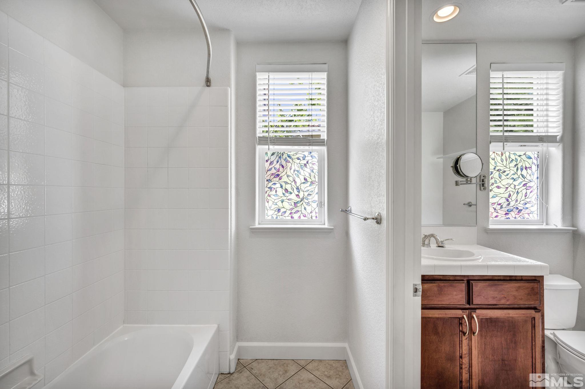 8210 Willow Ranch Trail Reno, NV 89523 - Photo 24 of 38 a bathroom with a bathtub and a sink