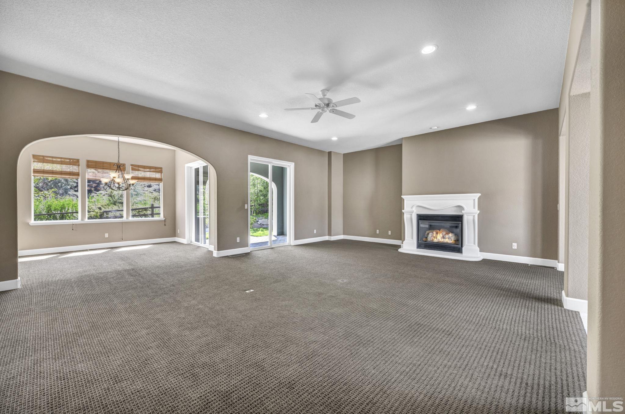 8210 Willow Ranch Trail Reno, NV 89523 - Photo 8 of 38 a view of an empty room with a fireplace