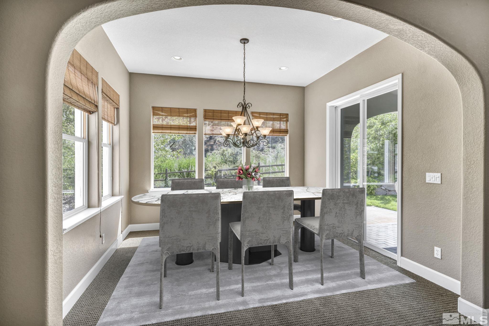 8210 Willow Ranch Trail Reno, NV 89523 - Photo 9 of 38 a view of a dining room with furniture window and outside view