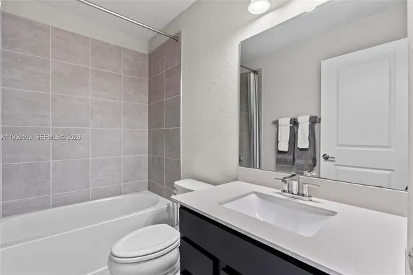 a bathroom with a bath tub and a shower