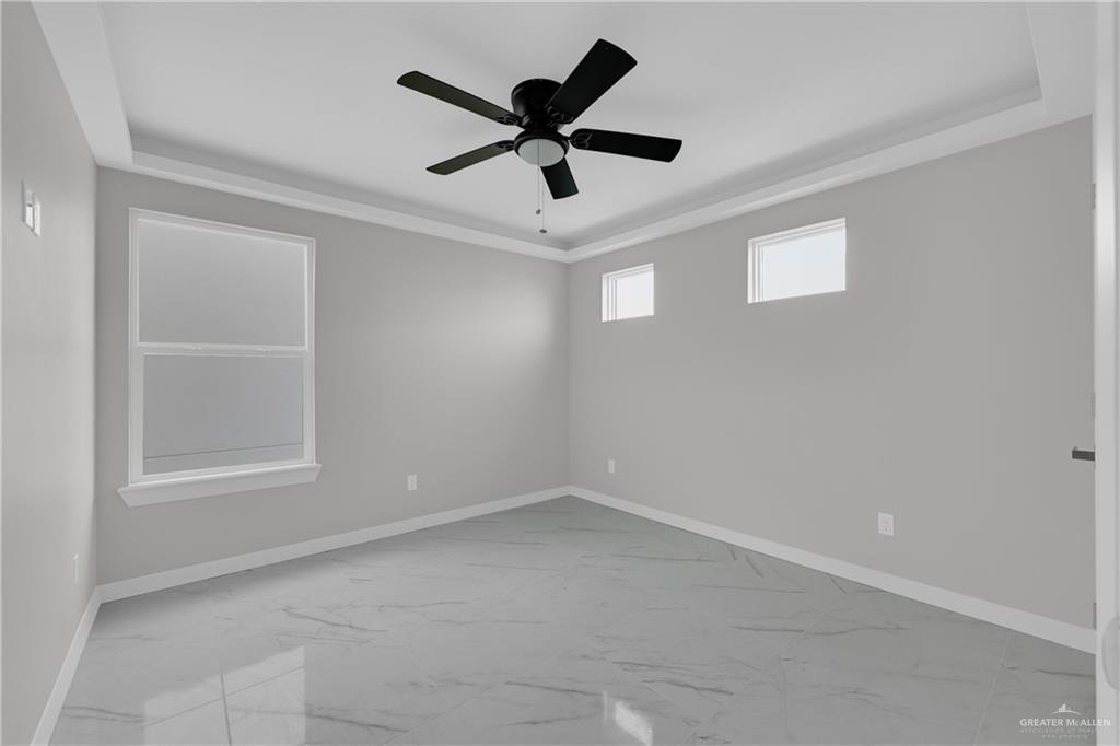 1836 Sunset Drive Mission, TX 78572 - Photo 18 of 24 an empty room with ceiling fan and window