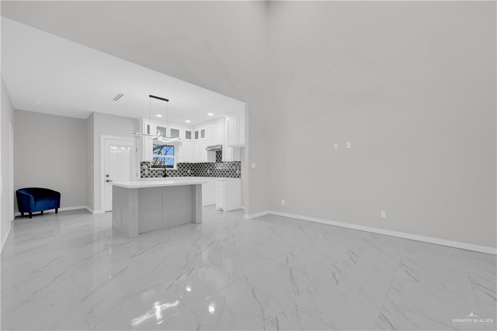 1836 Sunset Drive Mission, TX 78572 - Photo 4 of 24 a view of a kitchen with a sink and cabinets