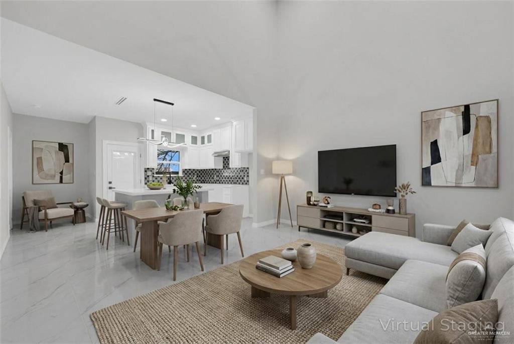 1836 Sunset Drive Mission, TX 78572 - Photo 5 of 24 a living room with furniture a rug and a flat screen tv
