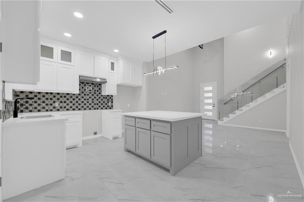 1836 Sunset Drive Mission, TX 78572 - Photo 6 of 24 a bathroom with a double vanity sink mirror and shower