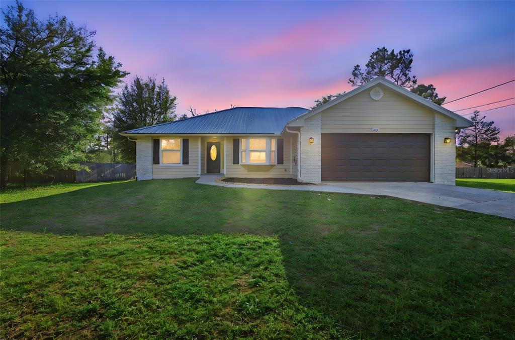 414 South Shell Road DeLand, FL 32720 - Photo 1 of 1 a house view with a garden space