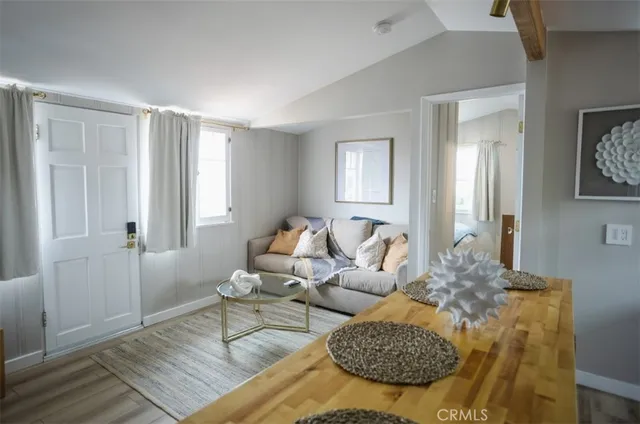 a living room with furniture rug and window