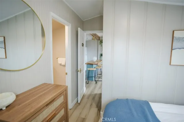 a room that has a bed and a mirror in it