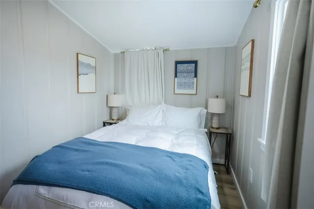 a bedroom with a bed and a cabinets