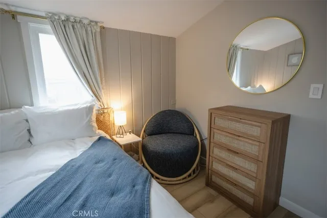 a bathroom with a toilet mirror and vanity