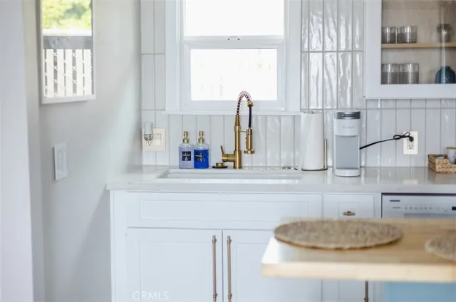 a kitchen with a sink and a window