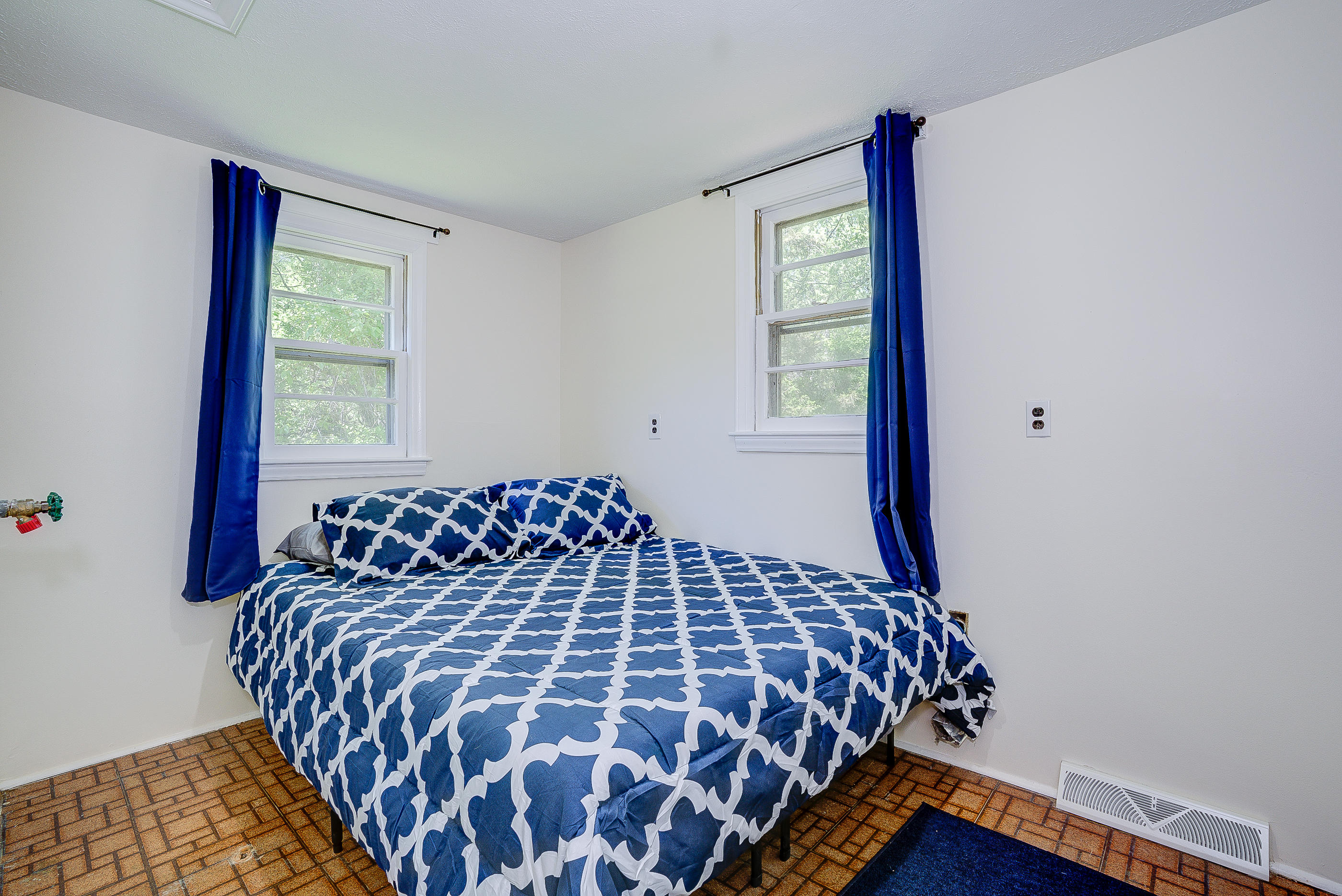 6150 Hardy Road Hardy, VA 24101 - Photo 11 of 17 a large bed with a black and white comforter