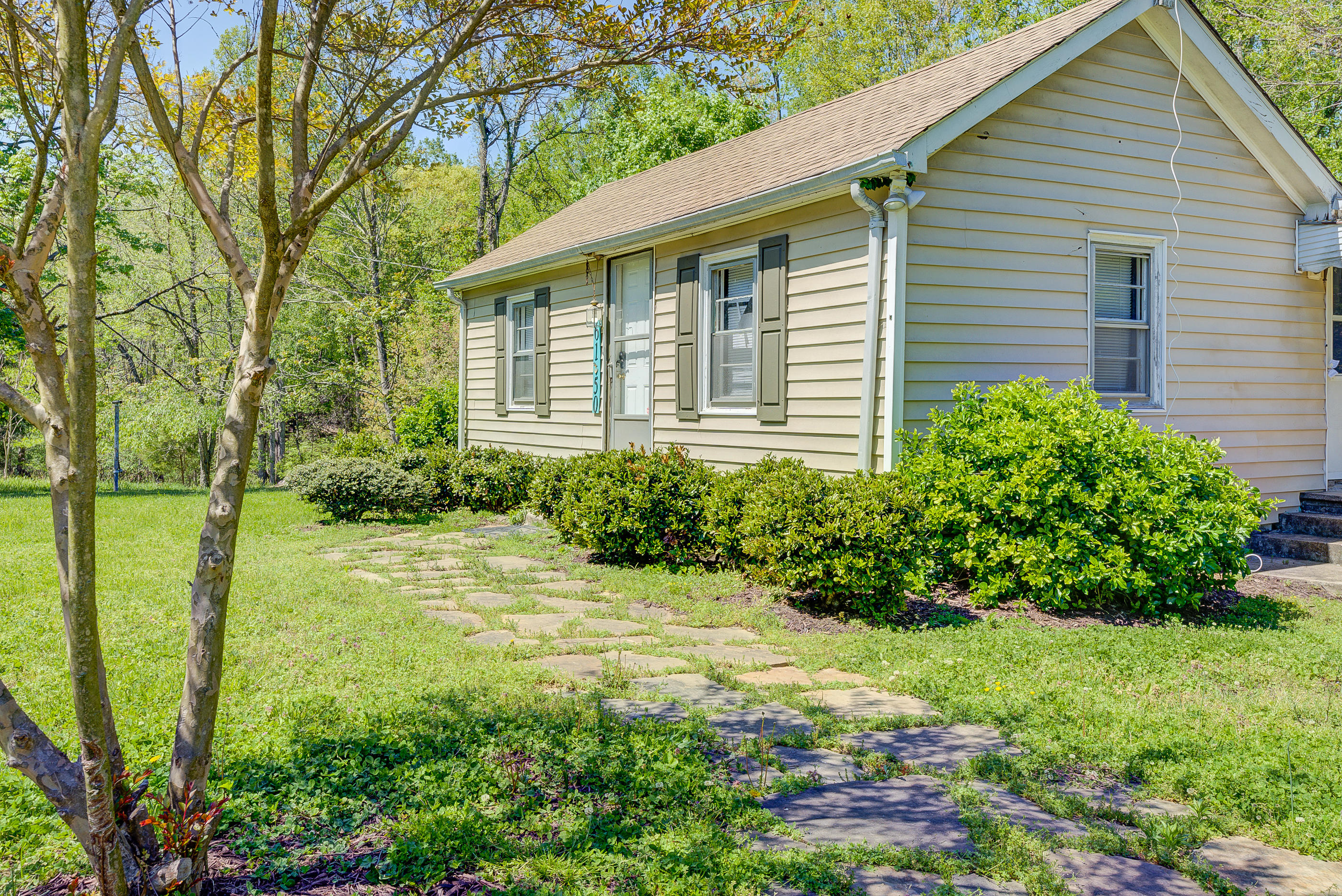6150 Hardy Road Hardy, VA 24101 - Photo 16 of 17 a view of a backyard with plants and large trees