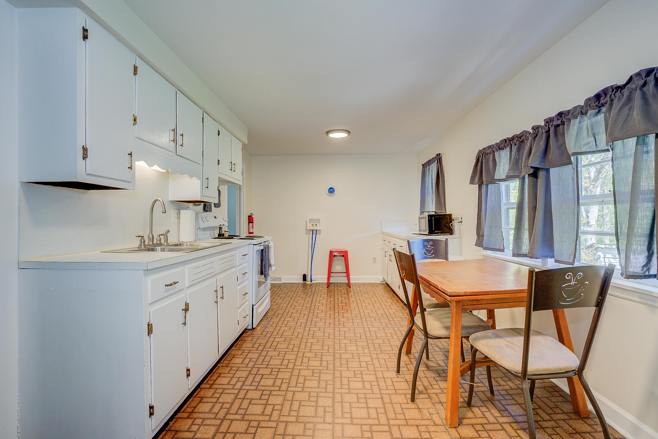 6150 Hardy Road Hardy, VA 24101 - Photo 6 of 17 a kitchen with stainless steel appliances kitchen island granite countertop a sink and cabinets
