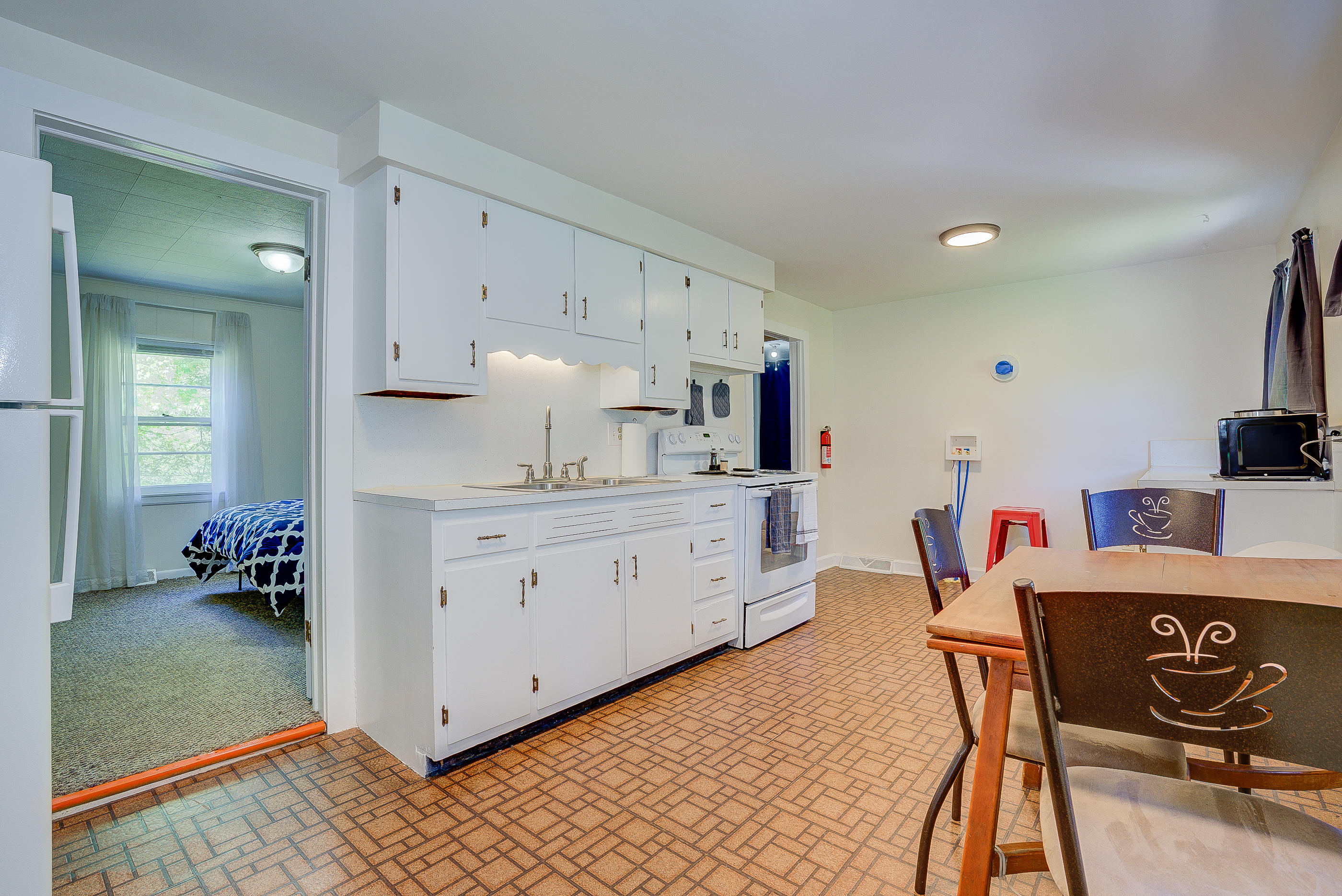 6150 Hardy Road Hardy, VA 24101 - Photo 7 of 17 a kitchen that has a lot of cabinets a sink and a stove in it