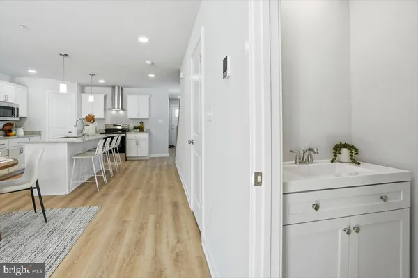 a view of a kitchen from the hallway