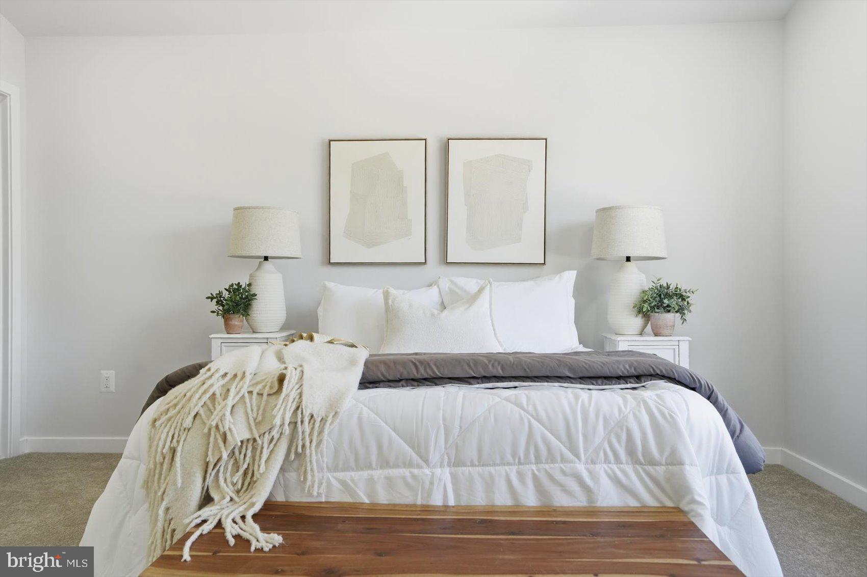 715 Hammonds Lane Baltimore, MD 21225 - Photo 20 of 29 a view of a bedroom with a bed and wooden floor