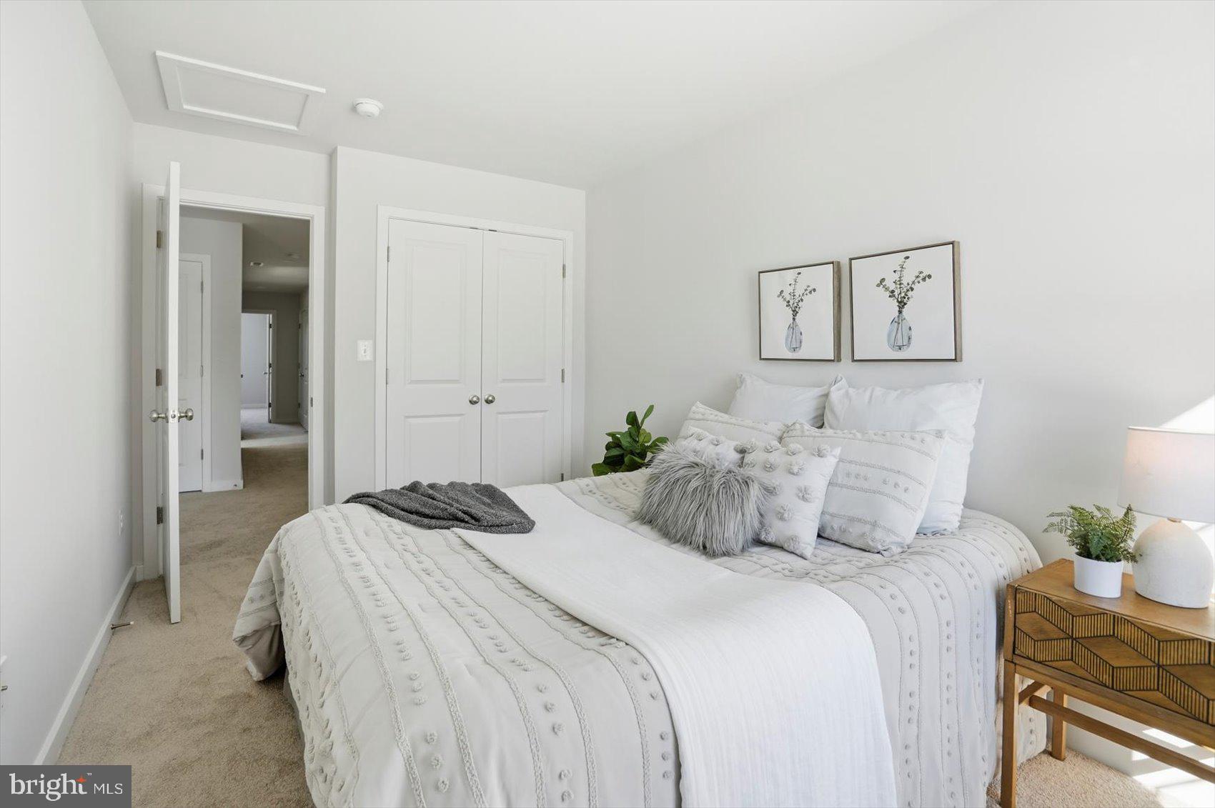 715 Hammonds Lane Baltimore, MD 21225 - Photo 21 of 29 a bedroom with a bed and painting on the wall