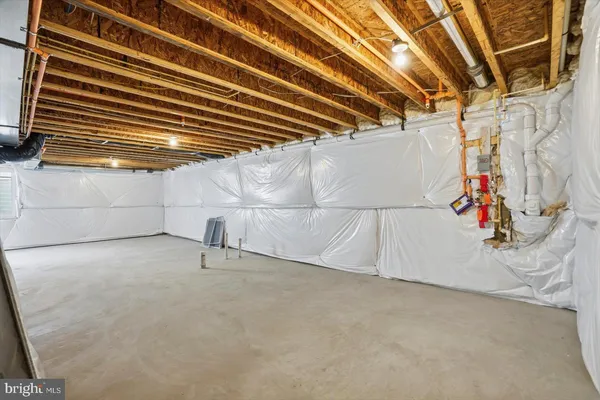 a view of a garage with rack and white walls