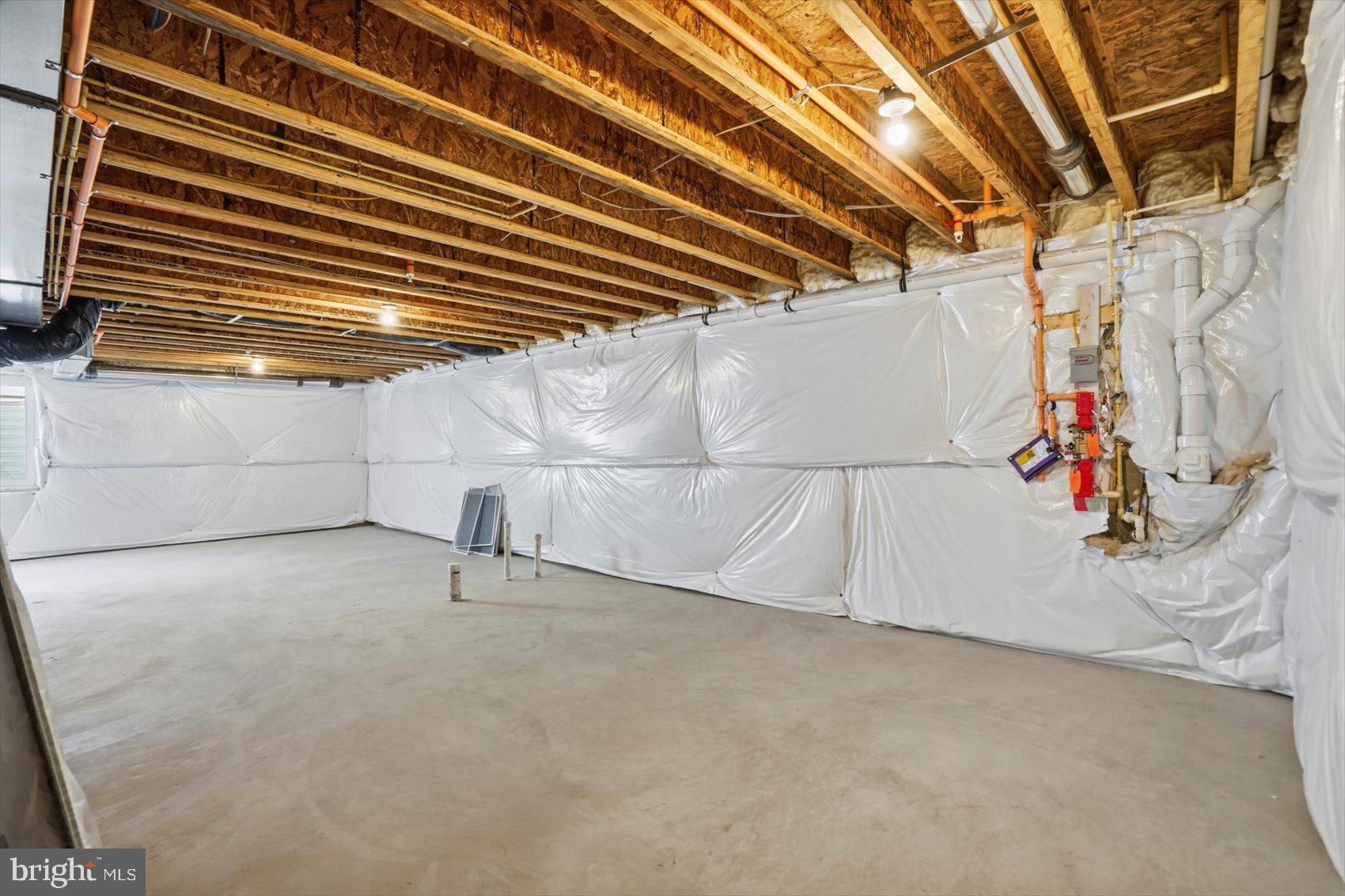 715 Hammonds Lane Baltimore, MD 21225 - Photo 27 of 29 a view of a garage with rack and white walls