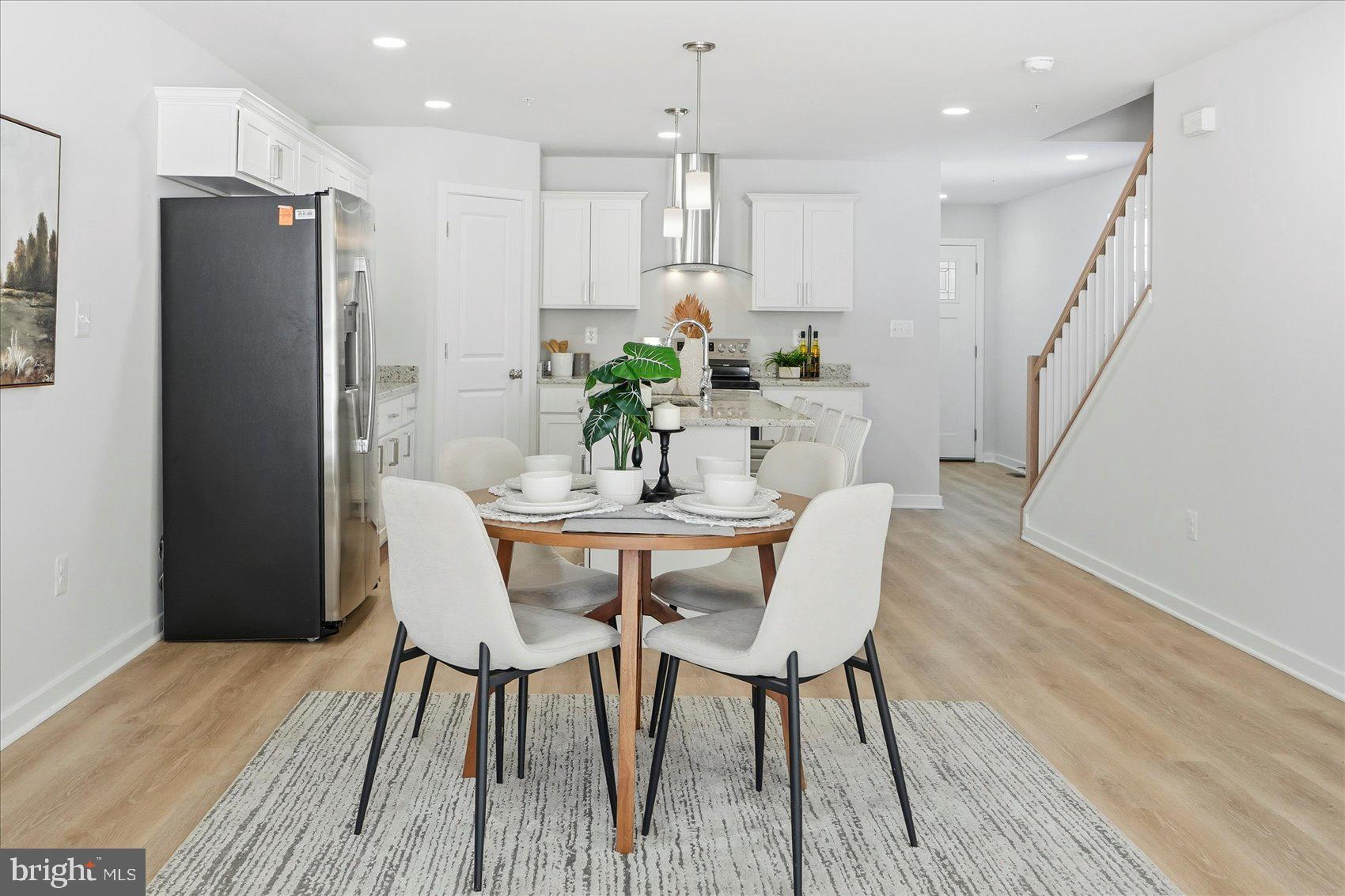 715 Hammonds Lane Baltimore, MD 21225 - Photo 6 of 29 a dining room with furniture and wooden floor