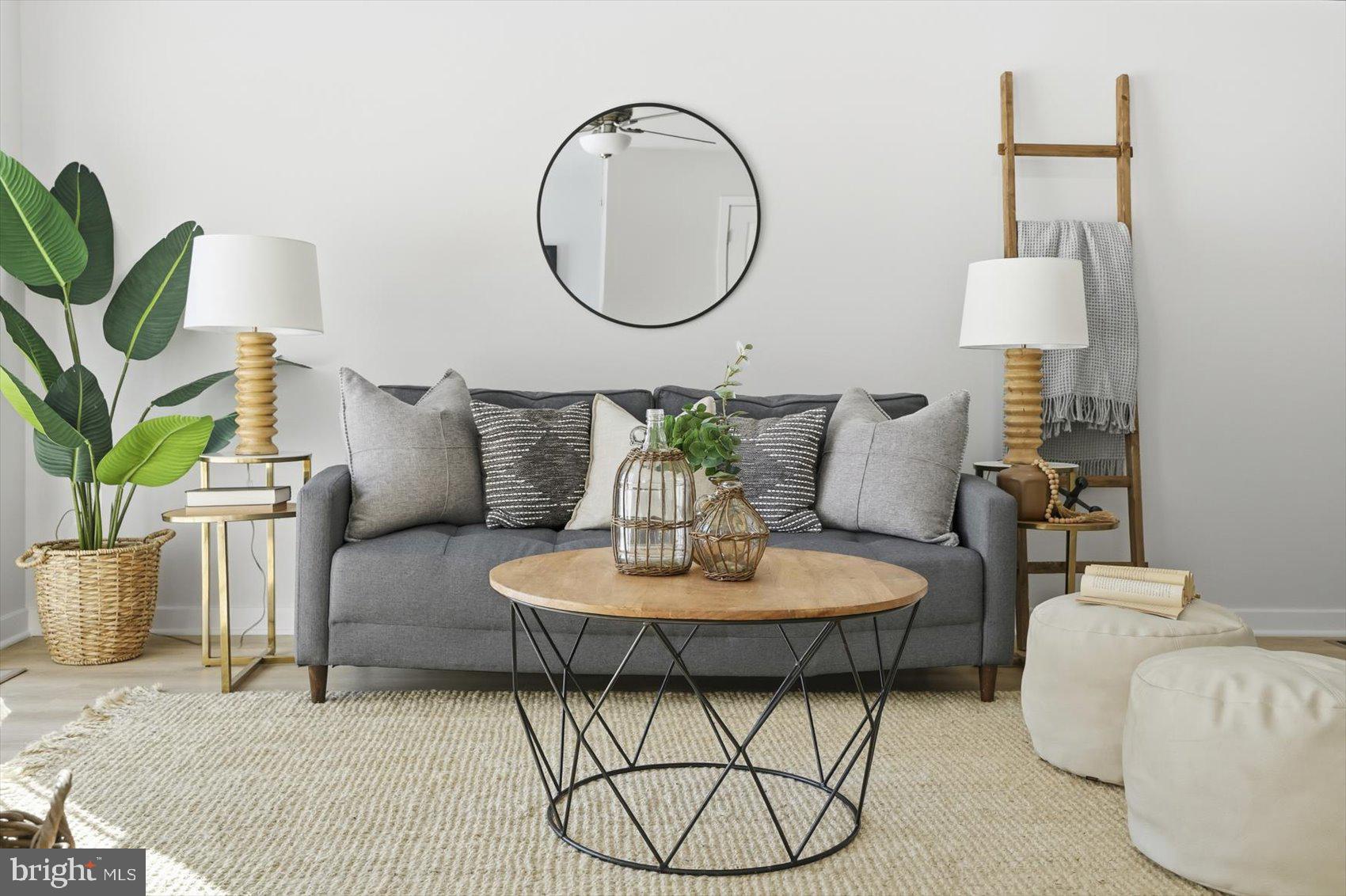 715 Hammonds Lane Baltimore, MD 21225 - Photo 10 of 29 a living room with furniture and a potted plant