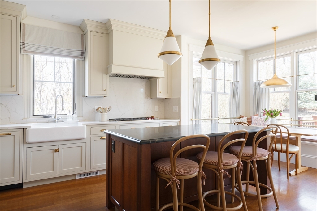 25 Barrington Road Boston, MA 02124 - Photo 7 of 33 a view of a dining room with furniture and windows