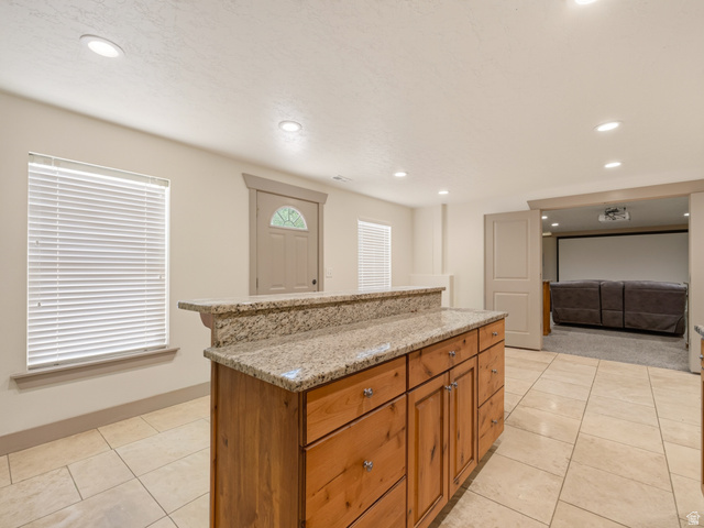 1279 West 1500th Street North Mapleton, UT 84664 - Photo 59 of 83 Kitchen island with a granite countertop and wood cabinetry