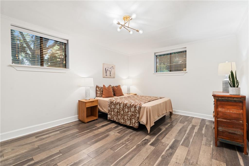 880 Glendale Terrace Northeast, Unit 9 Atlanta, GA 30308 - Photo 13 of 18 a bedroom with a bed table and chair