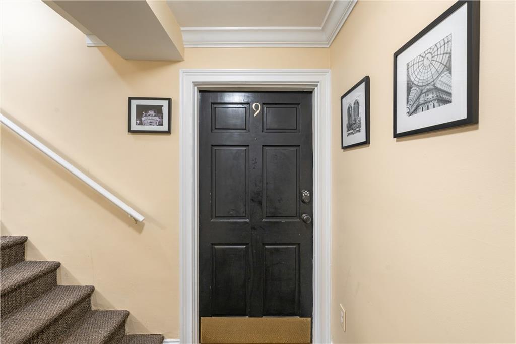 880 Glendale Terrace Northeast, Unit 9 Atlanta, GA 30308 - Photo 18 of 18 a view of hallway with wooden floor and cabinet