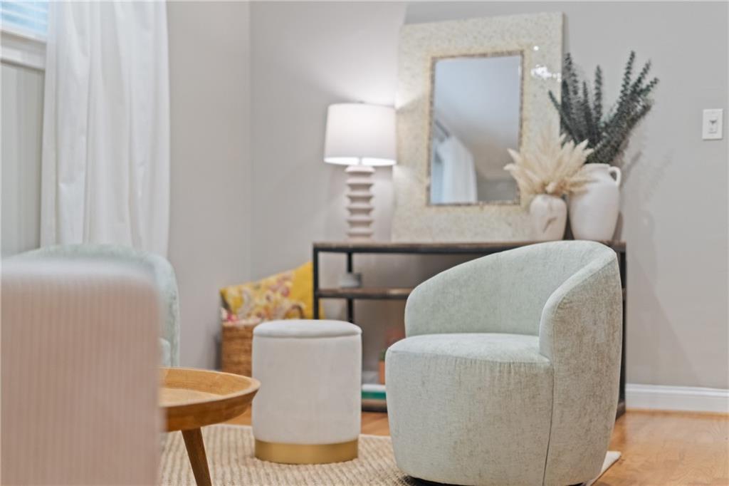 880 Glendale Terrace Northeast, Unit 9 Atlanta, GA 30308 - Photo 3 of 18 a living room with furniture and a lamp
