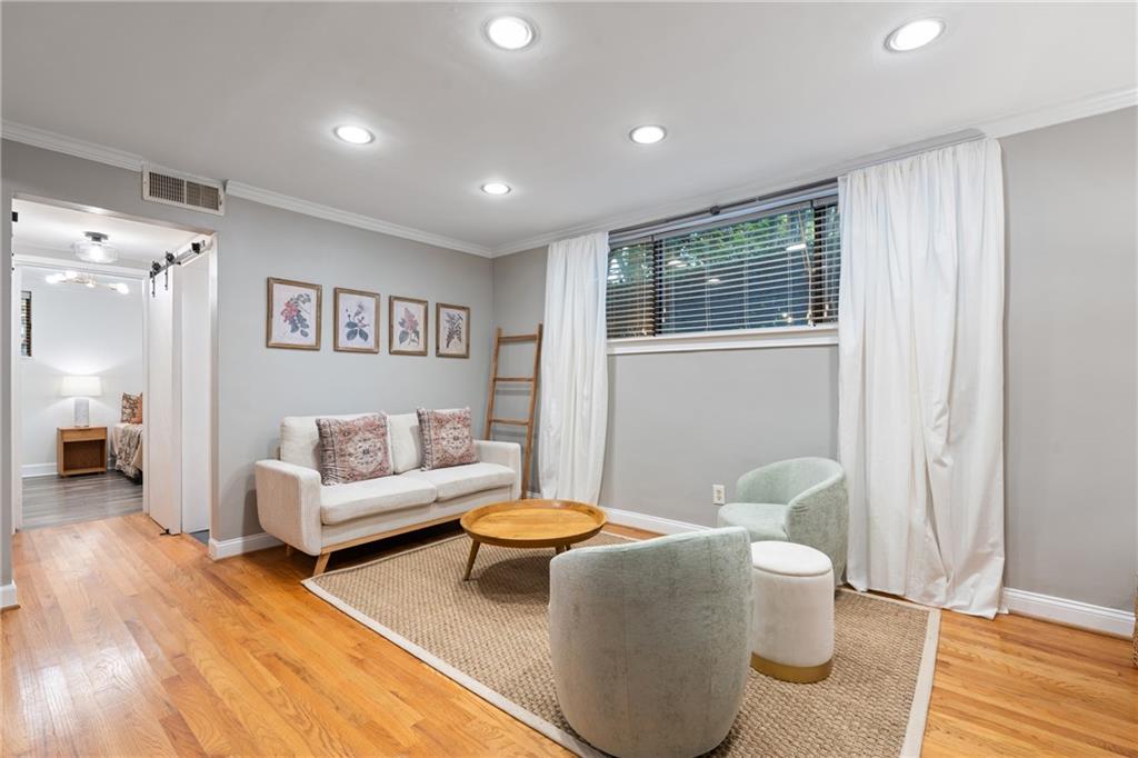 880 Glendale Terrace Northeast, Unit 9 Atlanta, GA 30308 - Photo 4 of 18 a living room with furniture and a table