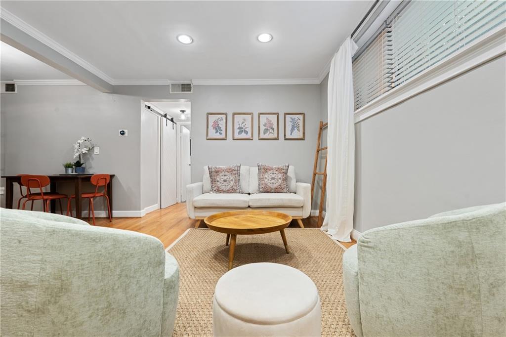880 Glendale Terrace Northeast, Unit 9 Atlanta, GA 30308 - Photo 6 of 18 a living room with a couch