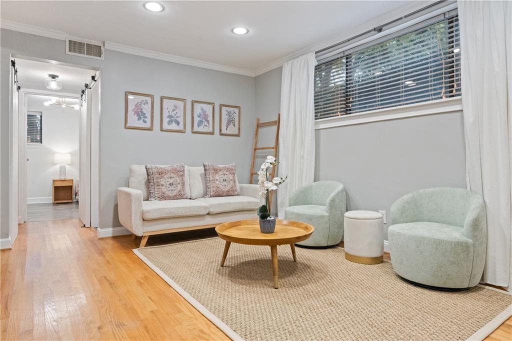 880 Glendale Terrace Northeast, Unit 9 Atlanta, GA 30308 - Photo 7 of 18 a living room with furniture and a potted plant