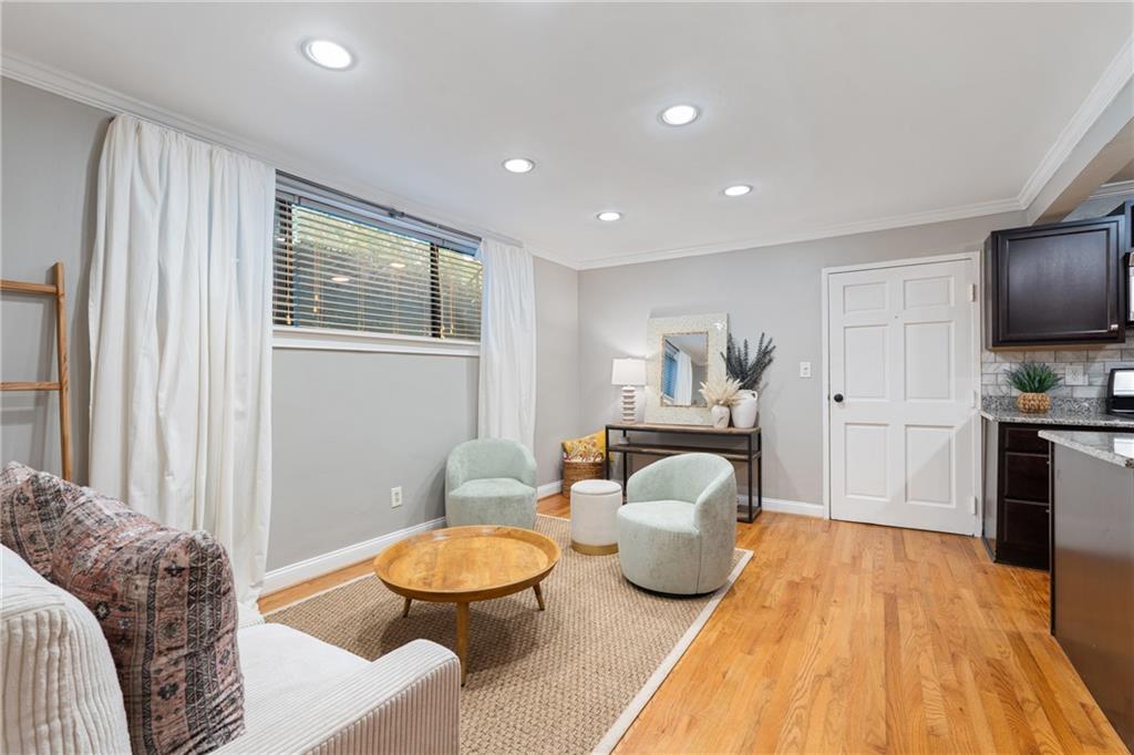 880 Glendale Terrace Northeast, Unit 9 Atlanta, GA 30308 - Photo 8 of 18 a spacious bedroom with a bed and a couch