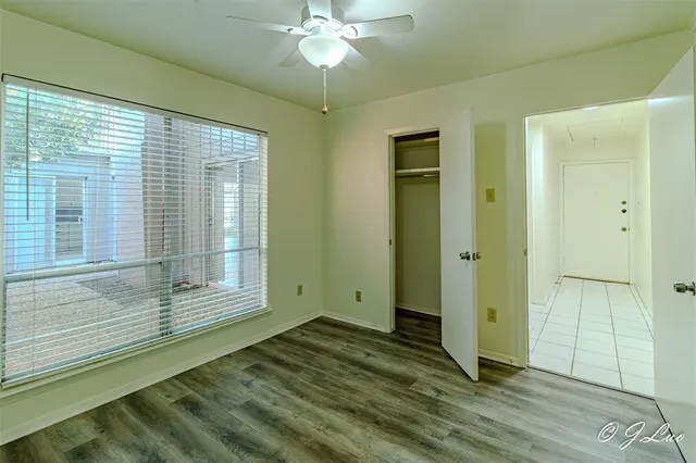 a view of wooden floor and cabinet in a room