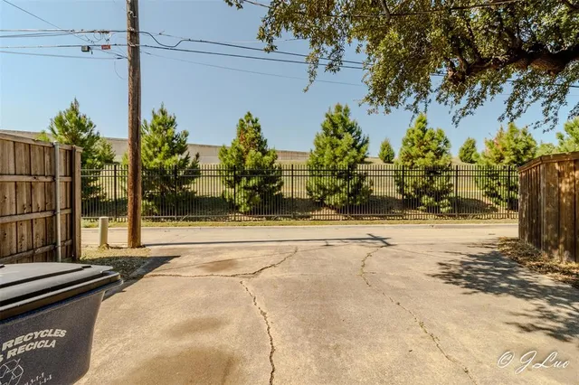 a view of a street along with trees