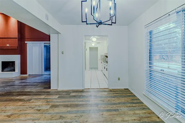 a view of a livingroom with wooden floor