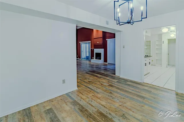 a view of a room with wooden floor and staircase