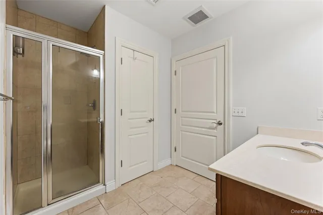 a bathroom with a sink and shower