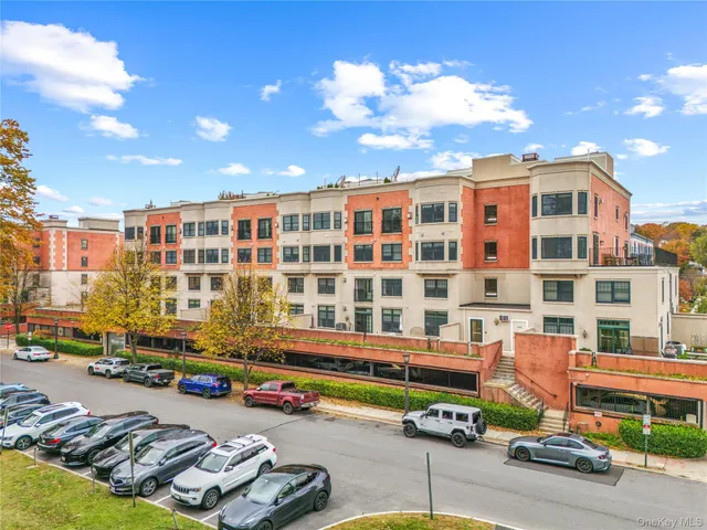 a front view of a building with street view