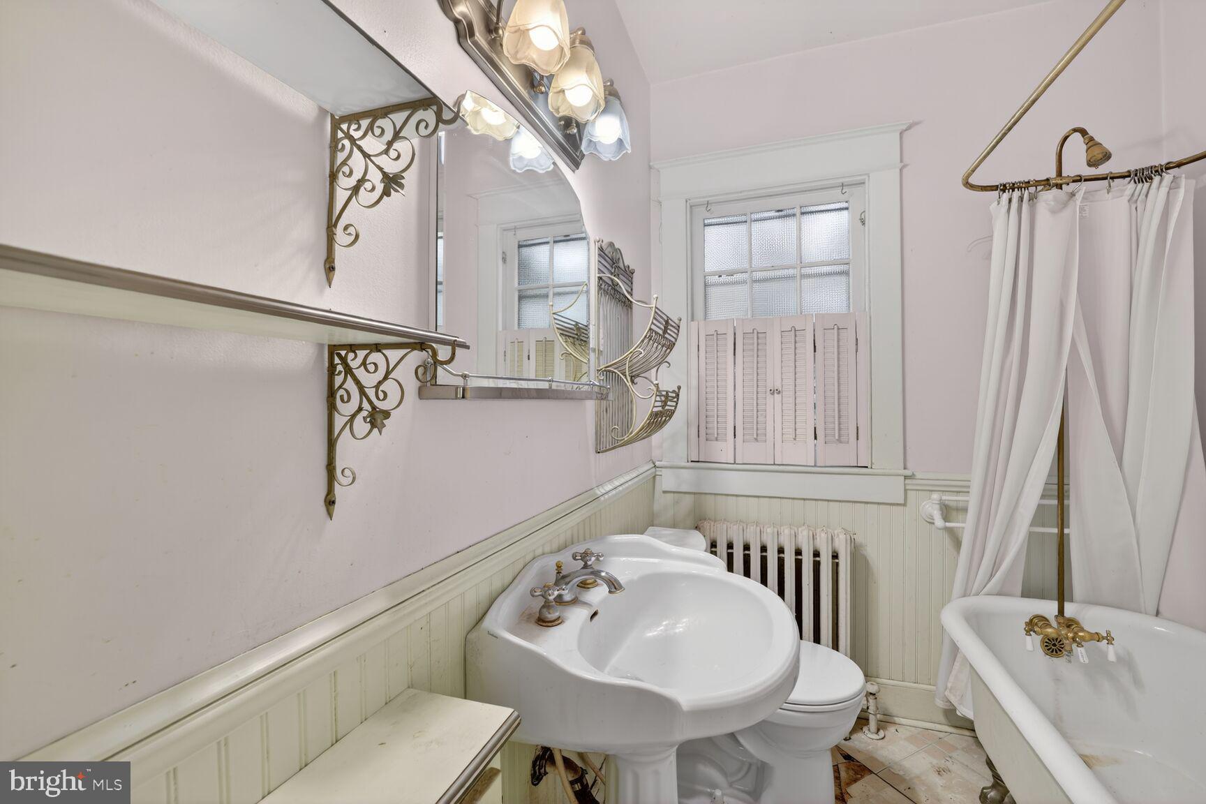 736 Easley Street Silver Spring, MD 20910 - Photo 11 of 51 a bathroom with a sink and a mirror