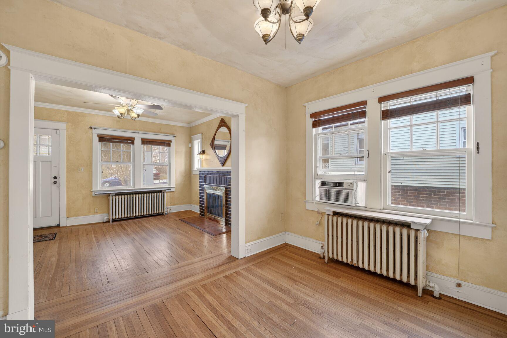 736 Easley Street Silver Spring, MD 20910 - Photo 13 of 51 wooden floor in an empty room with a window