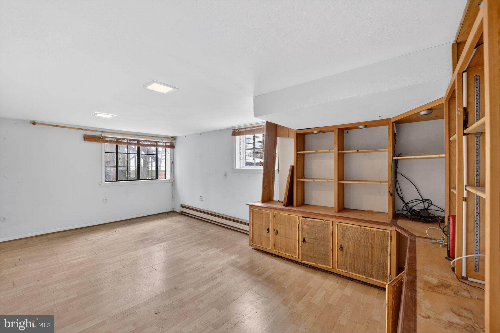 736 Easley Street Silver Spring, MD 20910 - Photo 19 of 51 a view of an empty room with window and hardwood floor