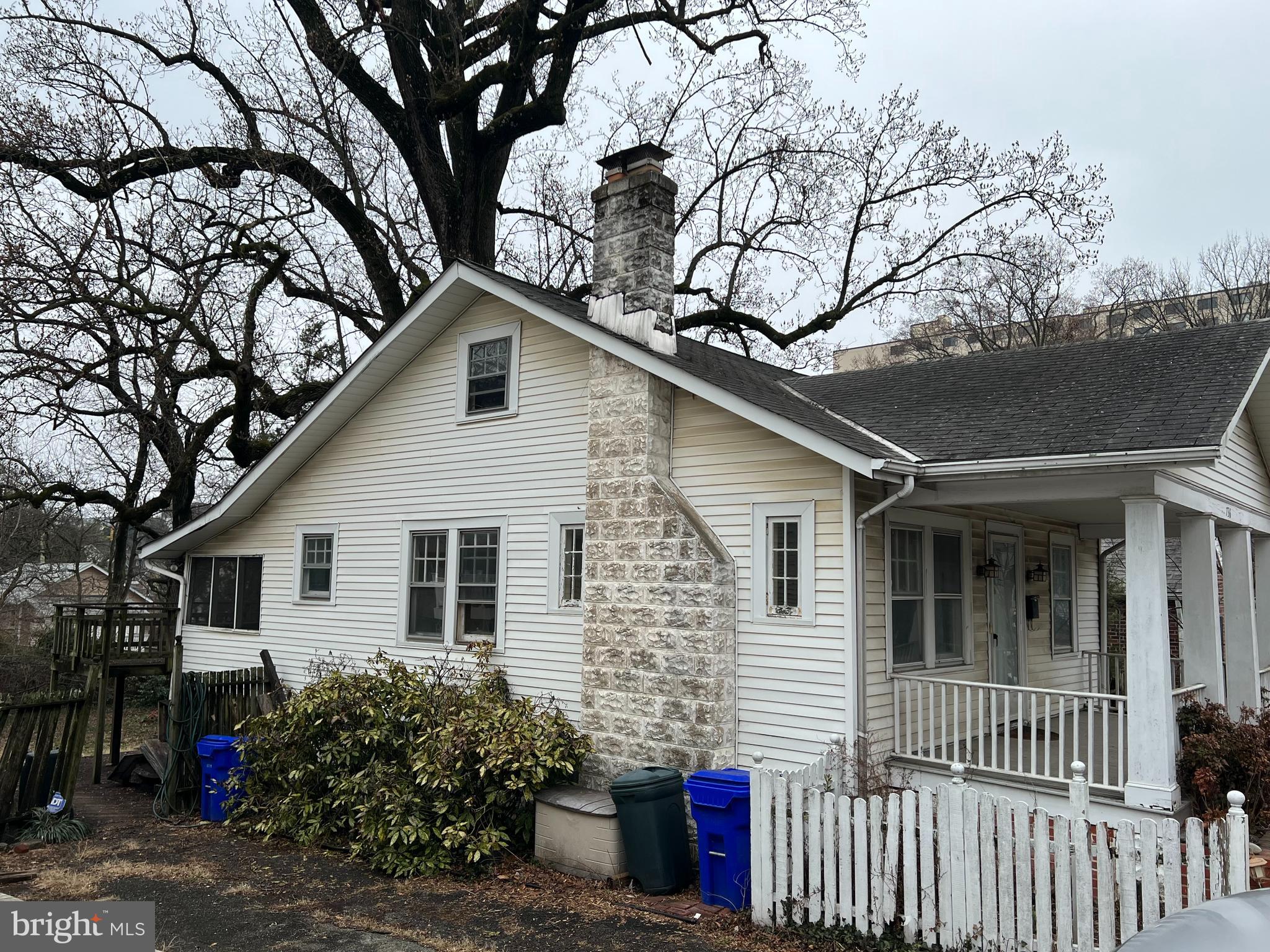736 Easley Street Silver Spring, MD 20910 - Photo 26 of 51 a front view of house with yard and trees around