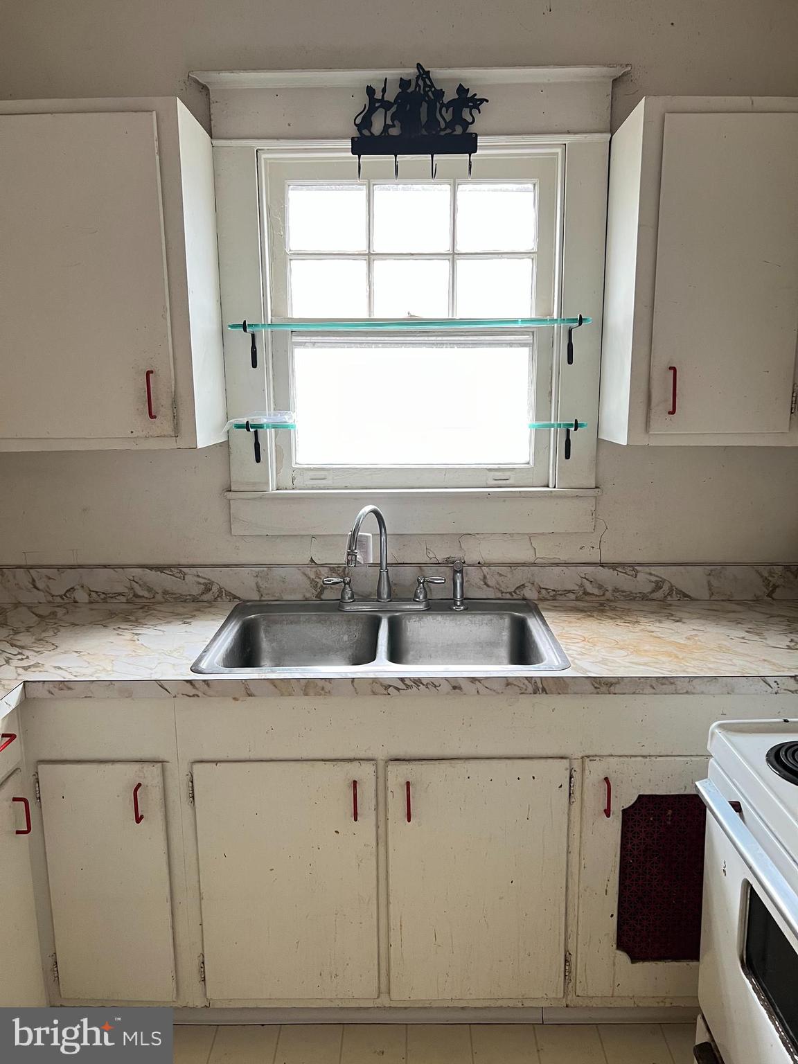 736 Easley Street Silver Spring, MD 20910 - Photo 30 of 51 a kitchen with cabinets appliances a sink and a window